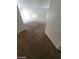 Open living room with carpet floors, great natural light, and kitchen access at 5316 Clover Blossom Ct, North Las Vegas, NV 89031