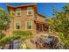 View of back exterior, patio and backyard at 5662 Escamilla Rd, Las Vegas, NV 89135