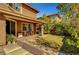 Covered patio and lounge area in back of the home at 5662 Escamilla Rd, Las Vegas, NV 89135