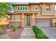 Charming two-story home with neutral paint, stone accents, a two-car garage, and manicured landscaping at 5662 Escamilla Rd, Las Vegas, NV 89135