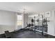 Bright home gym featuring mirrors, workout equipment, modern lighting at 5662 Escamilla Rd, Las Vegas, NV 89135