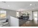 Bright home gym featuring mirrors, workout equipment, modern lighting, and wood floors at 5662 Escamilla Rd, Las Vegas, NV 89135