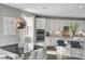 Bright kitchen features granite countertops, stainless steel appliances, pendant lighting, and an adjacent dining area at 5662 Escamilla Rd, Las Vegas, NV 89135