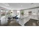 Open-concept kitchen and dining area with a large island, modern lighting, and plenty of natural light at 5662 Escamilla Rd, Las Vegas, NV 89135