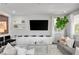 Open-concept living room with media center and comfortable seating area at 5662 Escamilla Rd, Las Vegas, NV 89135