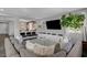 Comfortable living room with large sectional sofa and media center at 5662 Escamilla Rd, Las Vegas, NV 89135