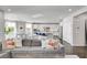 Open floor plan of a living room, dining area, and gourmet kitchen at 5662 Escamilla Rd, Las Vegas, NV 89135