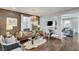 Comfortable living room features a modern chandelier, hardwood floors, and stylish decor at 5662 Escamilla Rd, Las Vegas, NV 89135