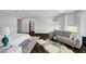 Spacious main bedroom with seating area, hardwood floors, natural light, and walk-in closet at 5662 Escamilla Rd, Las Vegas, NV 89135