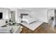 Main bedroom with seating area, hardwood floors, natural light, and neutral tones at 5662 Escamilla Rd, Las Vegas, NV 89135