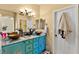 Bathroom featuring double sinks, decorative vanity, and ample mirror space at 5752 Shermer Ct, Las Vegas, NV 89120