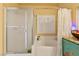 Bathroom with glass enclosed shower and tub combination at 5752 Shermer Ct, Las Vegas, NV 89120