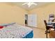 Small bedroom with a ceiling fan, desk and closet at 5752 Shermer Ct, Las Vegas, NV 89120