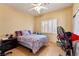 Bedroom with tile floors, white shutters, and good light at 5752 Shermer Ct, Las Vegas, NV 89120