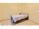 Plain bedroom with tile floors, small window and bed frame at 5752 Shermer Ct, Las Vegas, NV 89120