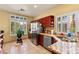 Bright kitchen with stainless steel appliances, granite countertops, and tiled floors at 5752 Shermer Ct, Las Vegas, NV 89120
