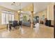 Spacious open-concept living area with tile flooring, bright windows, and decorative archways at 5752 Shermer Ct, Las Vegas, NV 89120