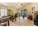 Living area with sliding doors, tiled floors, and natural light enhancing the open space at 5752 Shermer Ct, Las Vegas, NV 89120
