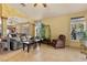 Open living area with tiled floors offering a view into the kitchen and dining space at 5752 Shermer Ct, Las Vegas, NV 89120