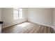 Bedroom with wood-style flooring, a window, and a view at 5828 Red Gull St, Las Vegas, NV 89149