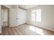 Sun-filled bedroom with wood flooring and sliding closet doors at 5828 Red Gull St, Las Vegas, NV 89149