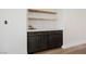 Stylish dry bar features shaker cabinets and wood floating shelves at 5828 Red Gull St, Las Vegas, NV 89149