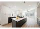 Modern kitchen with an island, white cabinets, and stainless steel appliances at 5828 Red Gull St, Las Vegas, NV 89149