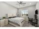 Neutral bedroom features a ceiling fan, recessed lighting, and natural light from a large window at 5860 Noah Springs Ct, Las Vegas, NV 89149