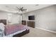 A bright bedroom featuring a ceiling fan, recessed lighting, and neutral walls at 5860 Noah Springs Ct, Las Vegas, NV 89149