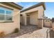 Inviting home entrance with stone accents, lush landscaping, and a paved walkway at 5860 Noah Springs Ct, Las Vegas, NV 89149