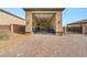 Open three-car garage with brick-paved driveway showing ample storage space at 5860 Noah Springs Ct, Las Vegas, NV 89149
