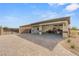 Exterior view of garage with multiple bays, side entrance, and brick driveway at 5860 Noah Springs Ct, Las Vegas, NV 89149