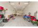 Large three-car garage interior featuring ample space for vehicles and storage at 5860 Noah Springs Ct, Las Vegas, NV 89149