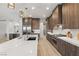 Open-concept kitchen with a large island, stainless appliances, and plenty of counter space at 5860 Noah Springs Ct, Las Vegas, NV 89149