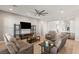 Spacious living room with contemporary decor, comfortable seating, and recessed lighting at 5860 Noah Springs Ct, Las Vegas, NV 89149
