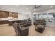 Open-concept living room with wood flooring, recessed lighting, and a view of the backyard at 5860 Noah Springs Ct, Las Vegas, NV 89149