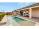 Backyard pool with covered patio, spa, and water feature at 5860 Noah Springs Ct, Las Vegas, NV 89149