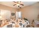 Comfortable bedroom offering neutral tones, a ceiling fan, and plenty of natural light at 6128 Forest Pony Ave, Las Vegas, NV 89122
