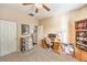 The bedroom has a ceiling fan, carpet, and an adjacent desk area at 6128 Forest Pony Ave, Las Vegas, NV 89122