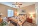 Cozy bedroom features a ceiling fan, neutral walls, and warm lighting for a relaxing ambiance at 6128 Forest Pony Ave, Las Vegas, NV 89122