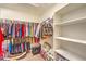 Walk-in closet with shelving and hanging racks at 6128 Forest Pony Ave, Las Vegas, NV 89122