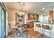 Bright kitchen and dining area featuring natural light and an island with seating at 6128 Forest Pony Ave, Las Vegas, NV 89122