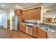 Bright kitchen featuring stainless steel appliances, wood floors, and granite countertops at 6128 Forest Pony Ave, Las Vegas, NV 89122