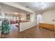 Bright living room with hardwood floors, neutral walls, and open layout at 6128 Forest Pony Ave, Las Vegas, NV 89122