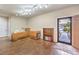 Bright living room with hardwood floors, track lighting, and a sewing station at 6128 Forest Pony Ave, Las Vegas, NV 89122
