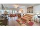 Cozy living room with neutral paint, comfortable seating, and natural light at 6128 Forest Pony Ave, Las Vegas, NV 89122