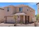 Charming two-story home with a two car garage, desert landscaping, and covered entry at 6221 Blood Lily Ave, Las Vegas, NV 89122