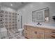 Modern bathroom showcasing patterned tile, a glass-enclosed shower, and a sleek vanity at 6265 Iron Mountain Rd, Las Vegas, NV 89131