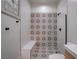 Stylish bathroom featuring patterned tile, a glass shower, and a built-in bench at 6265 Iron Mountain Rd, Las Vegas, NV 89131