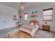 Cozy bedroom with brick wall, comfortable bed, and playful decorations at 6265 Iron Mountain Rd, Las Vegas, NV 89131